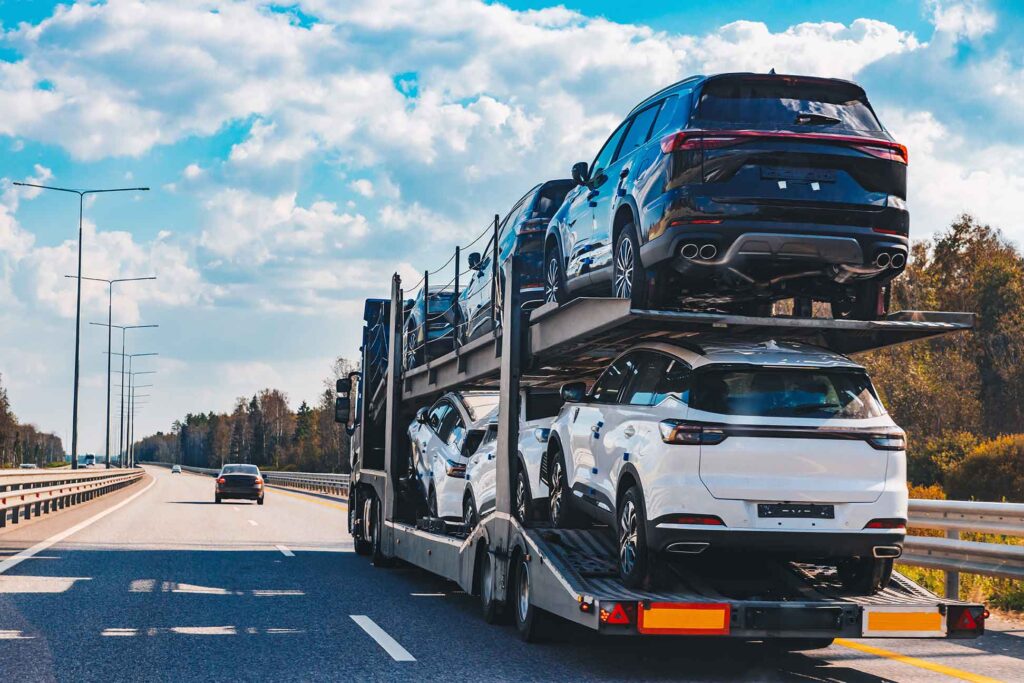 Car hauler transporting cars on the highway.